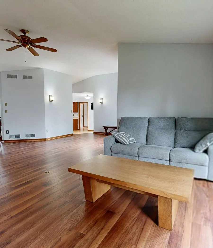 Wide-plank hardwood flooring in a Vanderbilt Beach, Florida home